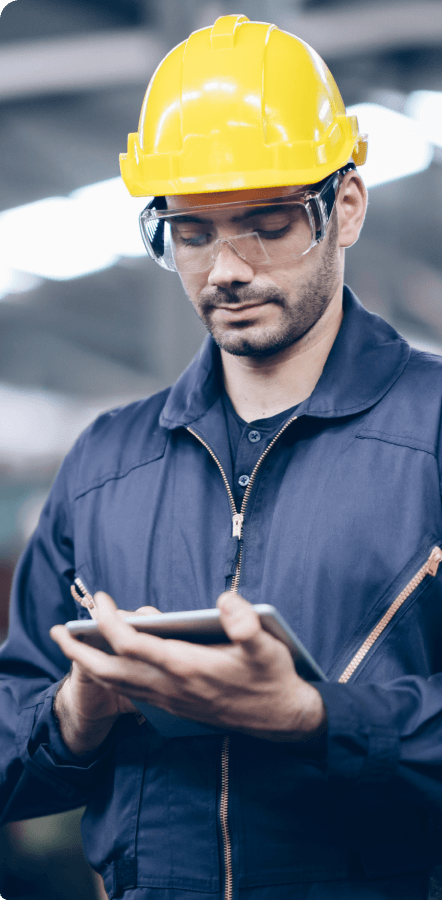Man on tablet inputing data into GoCanvas digital form on tablet.